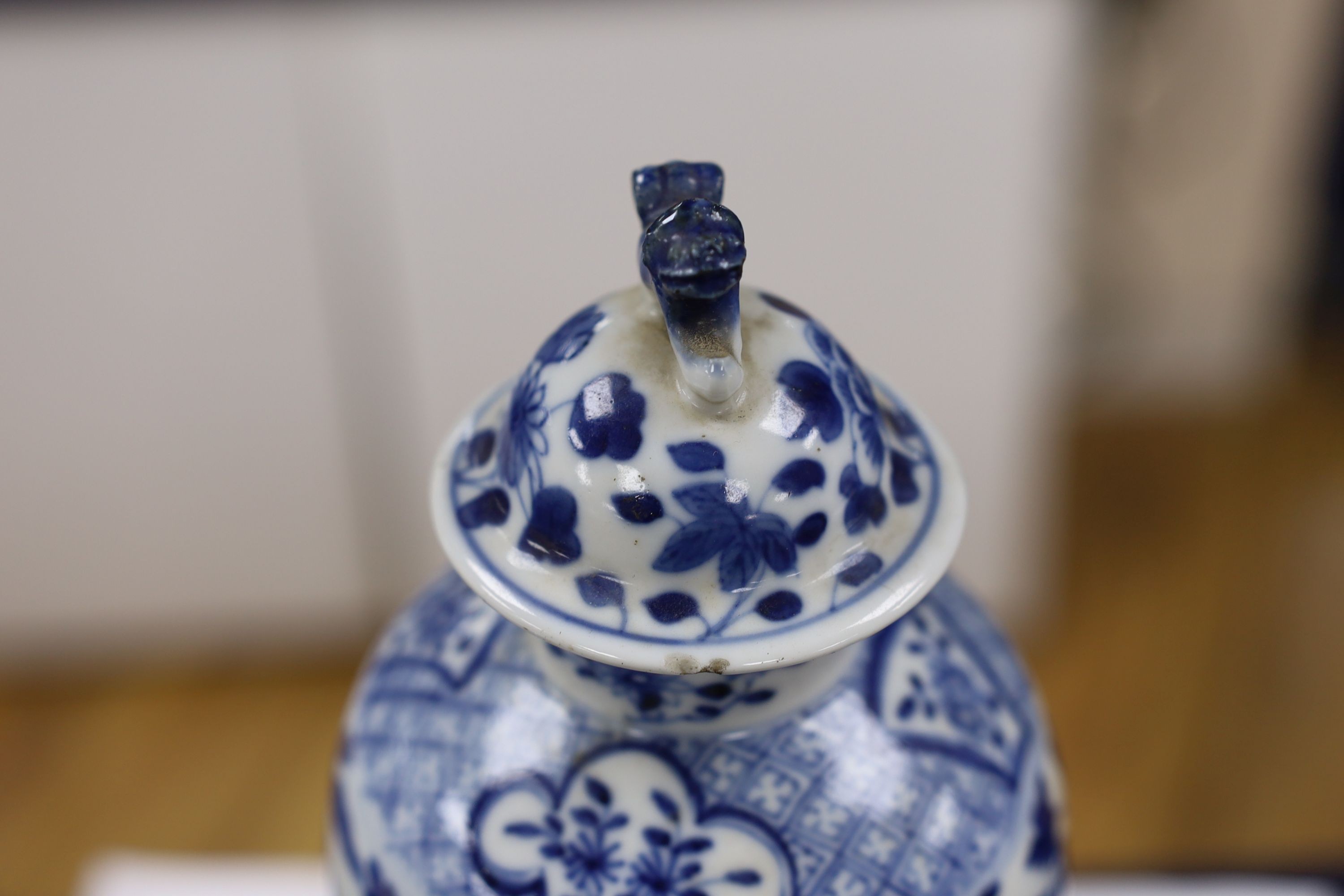 A pair of Chinese blue and white dragon vases and covers, circa 1900. 28cm